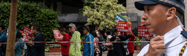 Rare Hong Kong protest takes place under heavy supervision